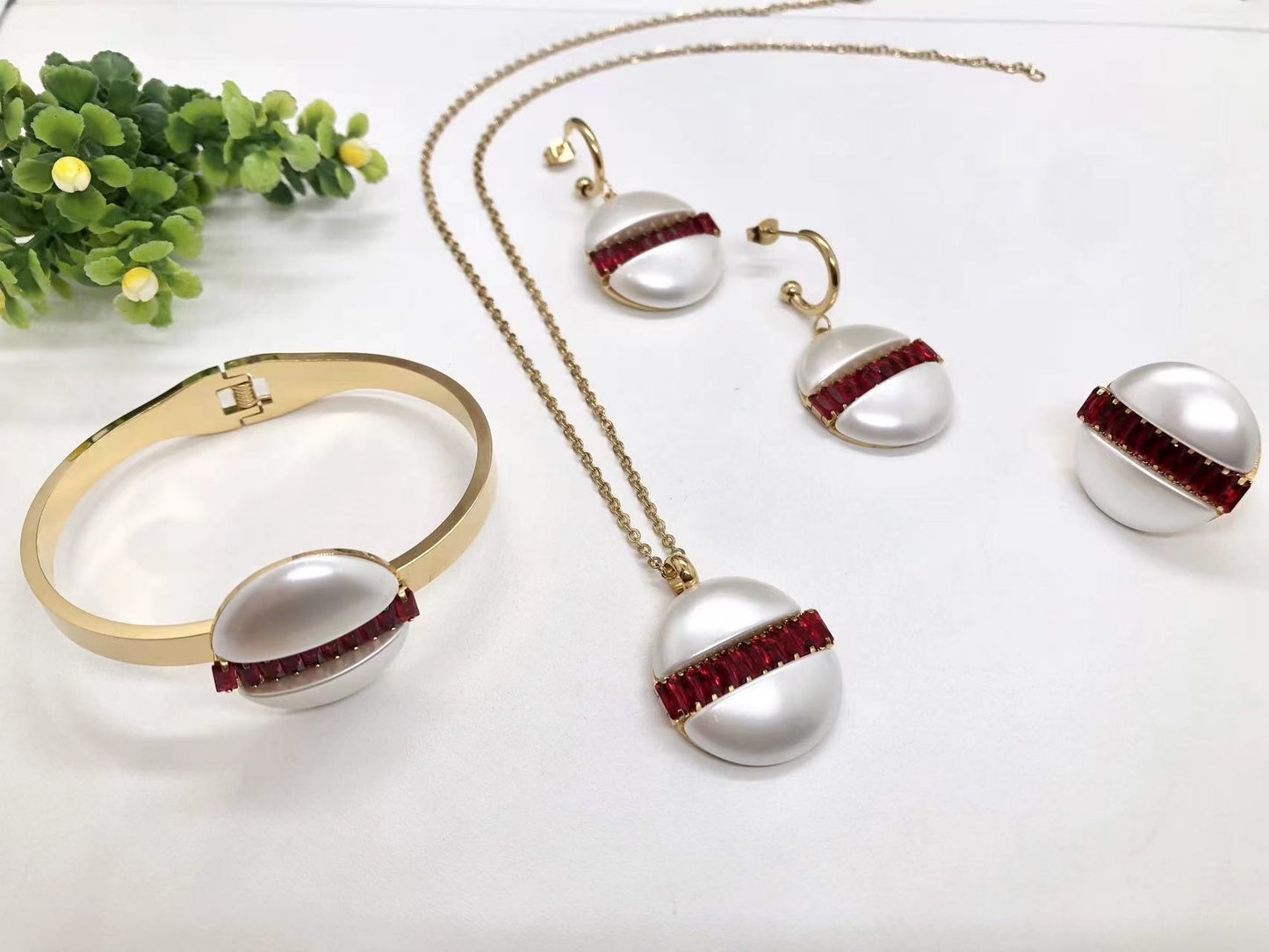 Gorgeous women's stainless steel necklace, earrings, bracelet, and ring set