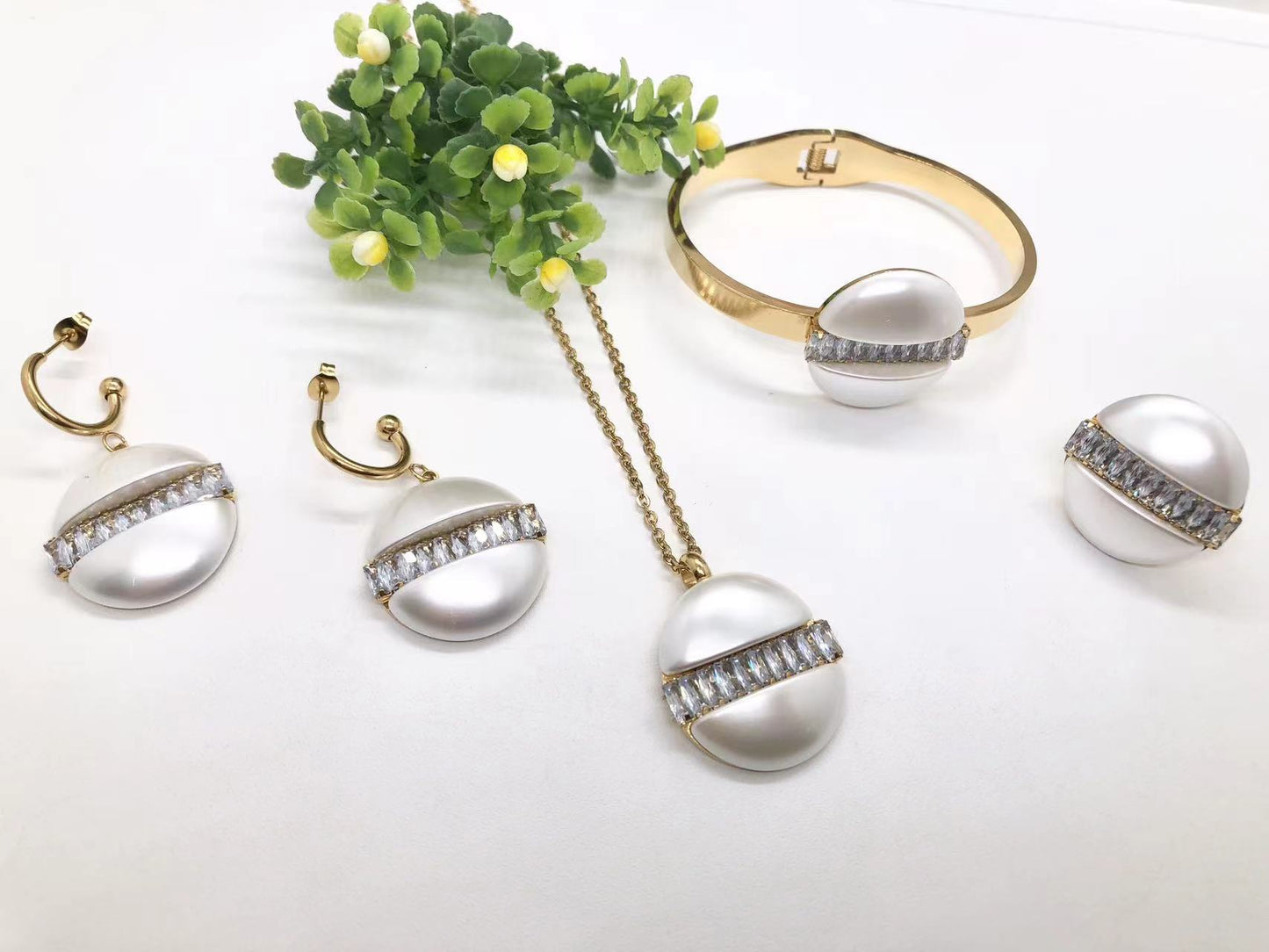 Gorgeous women's stainless steel necklace, earrings, bracelet, and ring set