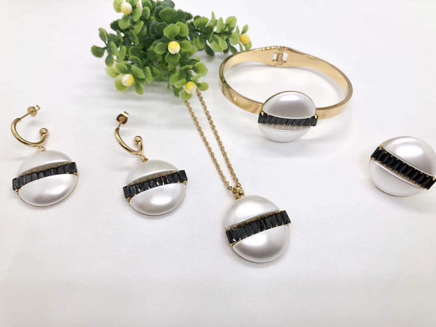 Gorgeous women's stainless steel necklace, earrings, bracelet, and ring set