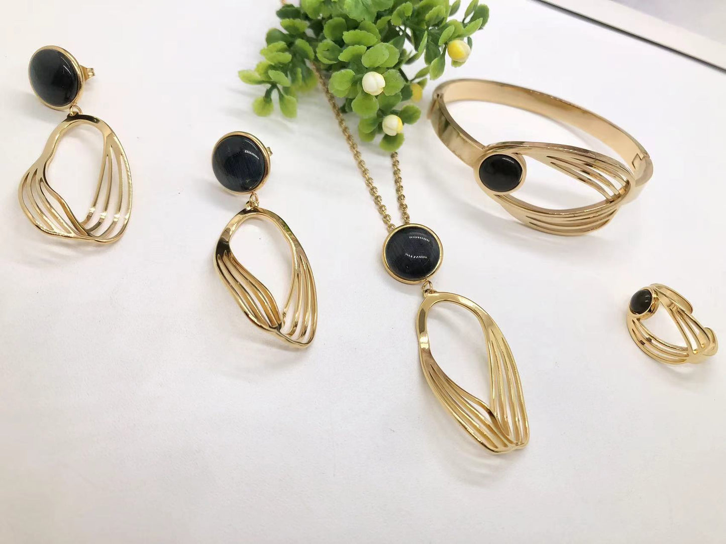 Gorgeous women's stainless steel necklace, earrings, bracelet, and ring set