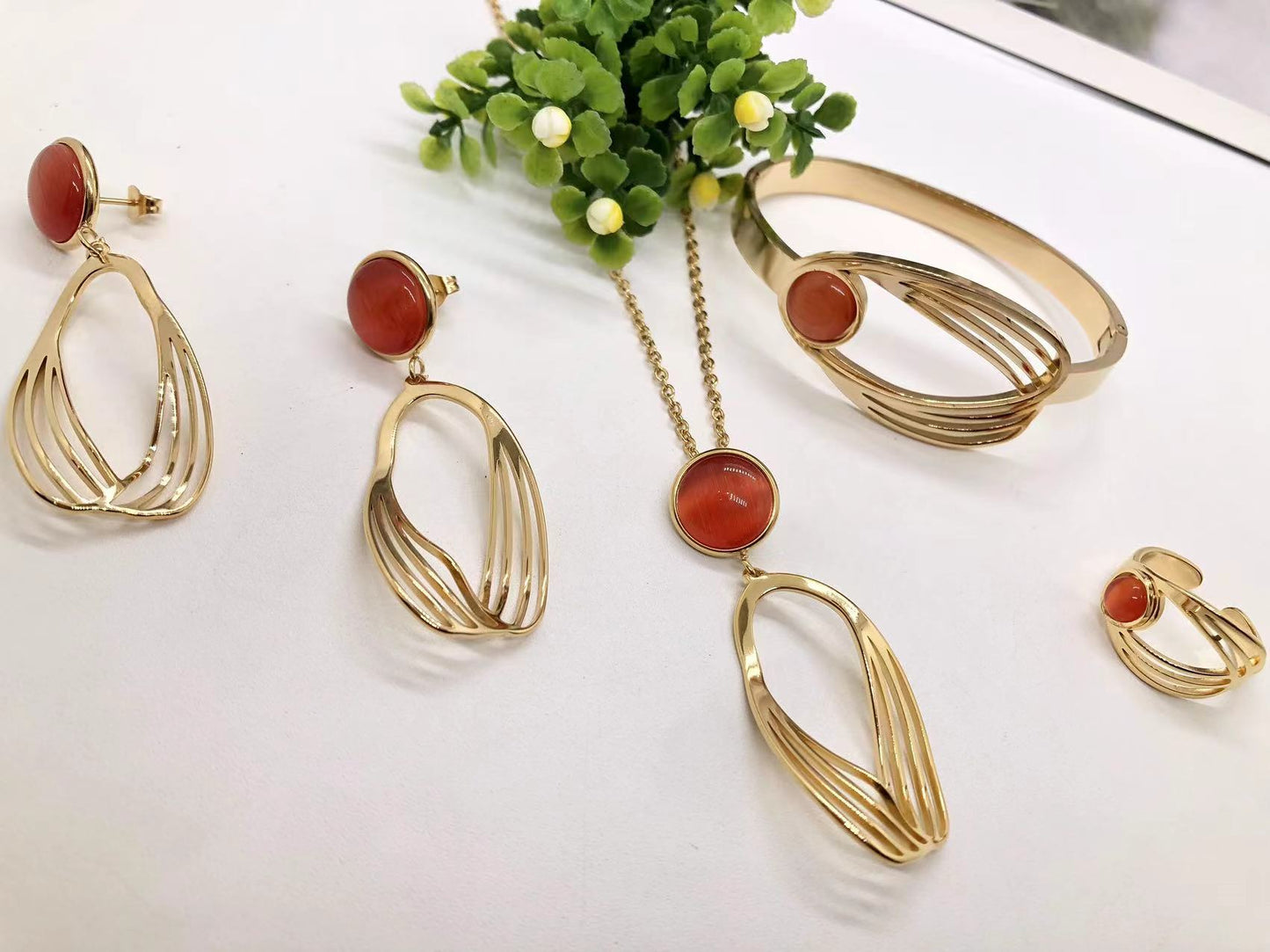 Gorgeous women's stainless steel necklace, earrings, bracelet, and ring set