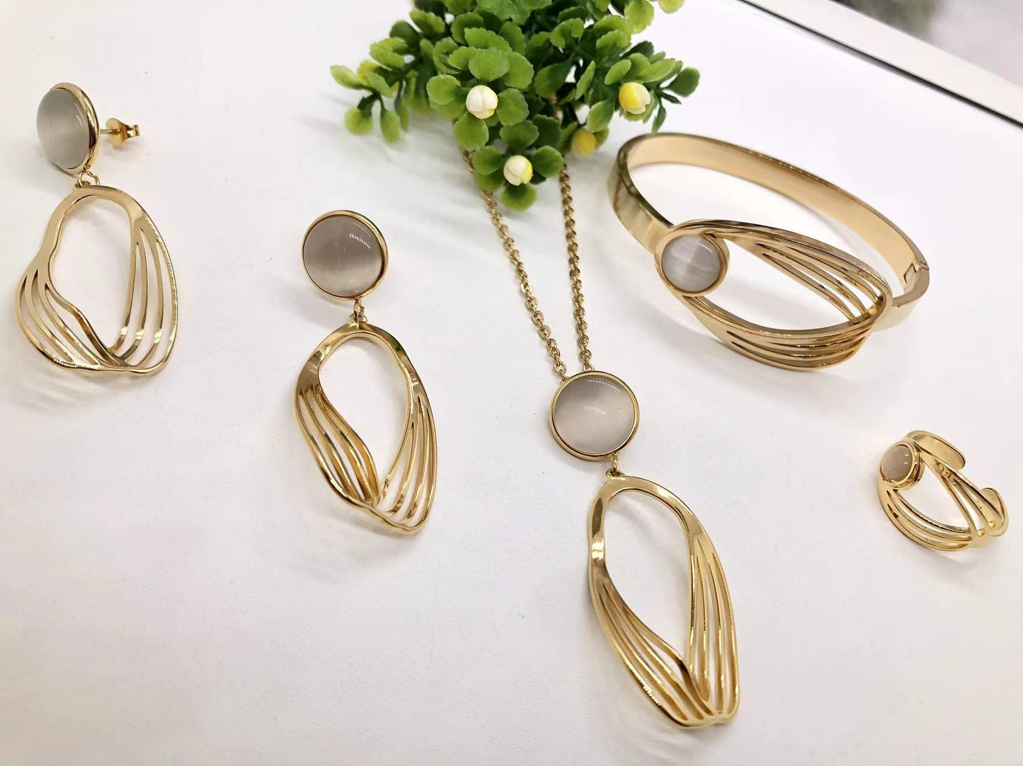 Gorgeous women's stainless steel necklace, earrings, bracelet, and ring set