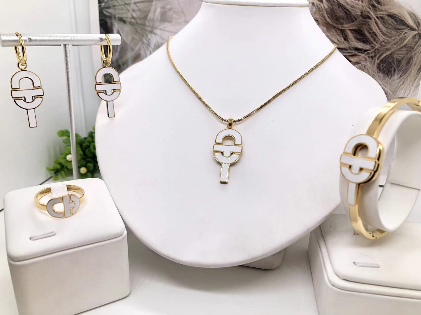Gorgeous women's stainless steel necklace, earrings, bracelet, and ring set