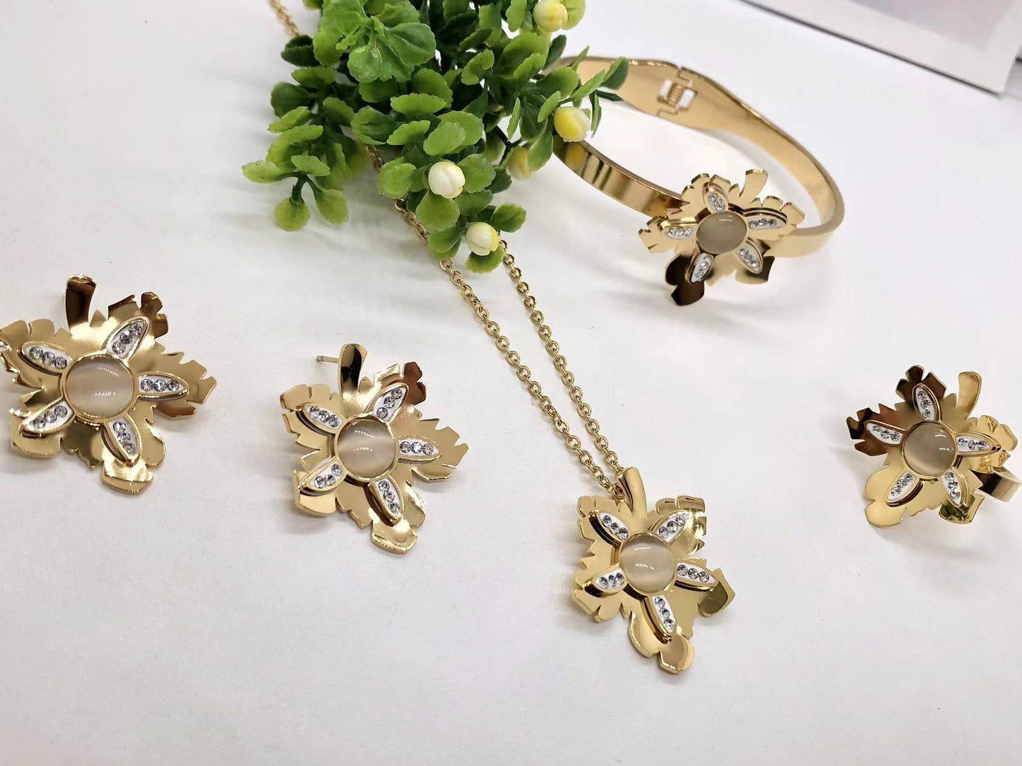 Gorgeous women's stainless steel necklace, earrings, bracelet, and ring set