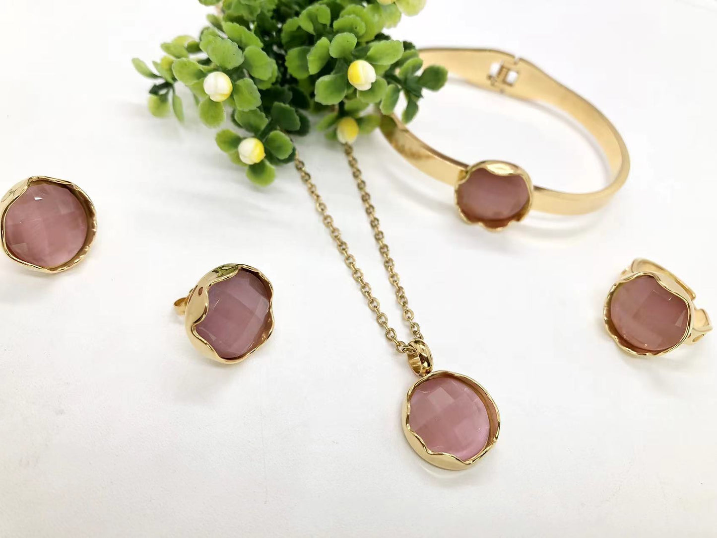 Gorgeous women's stainless steel necklace, earrings, bracelet, and ring set
