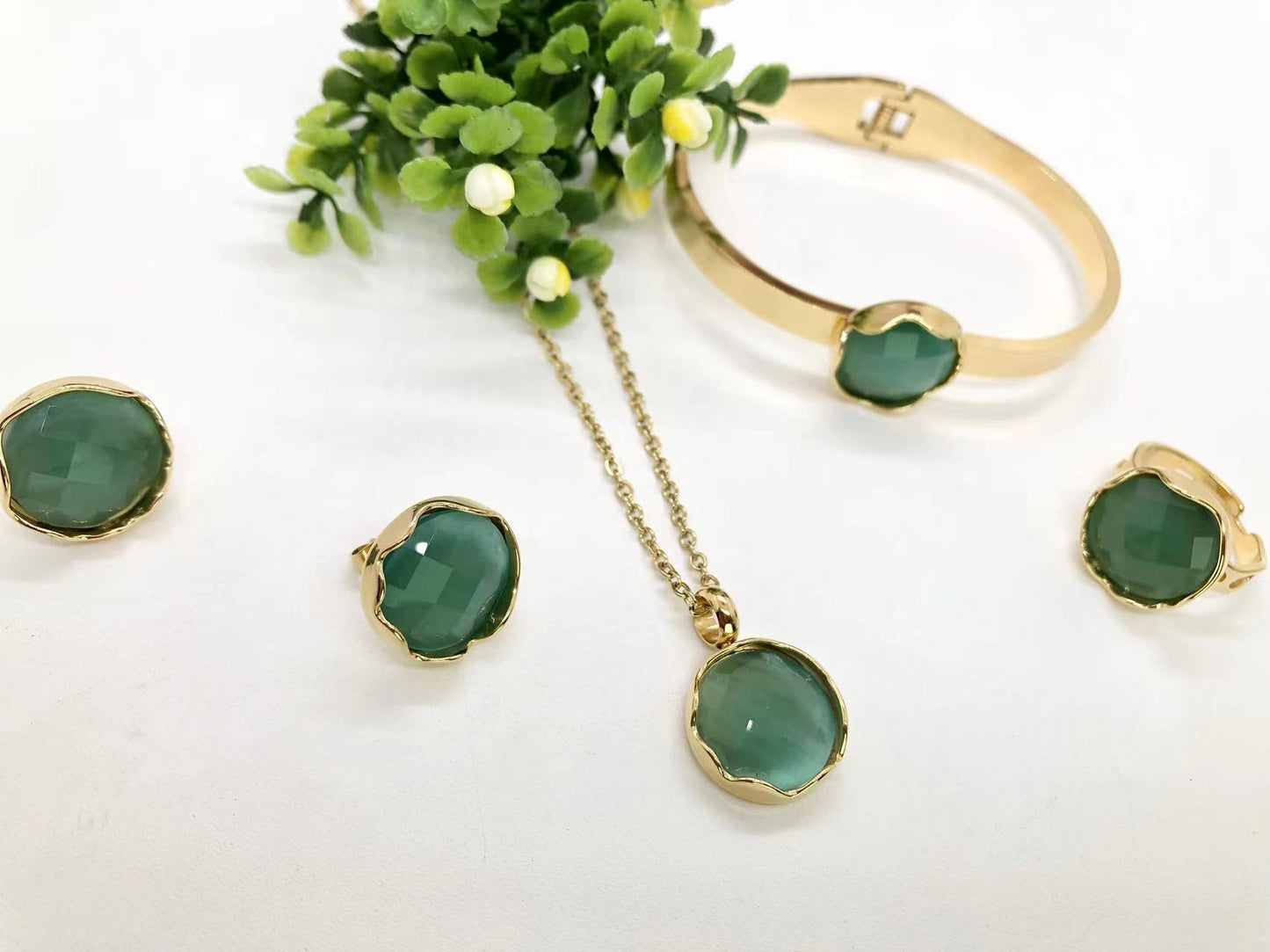Gorgeous women's stainless steel necklace, earrings, bracelet, and ring set