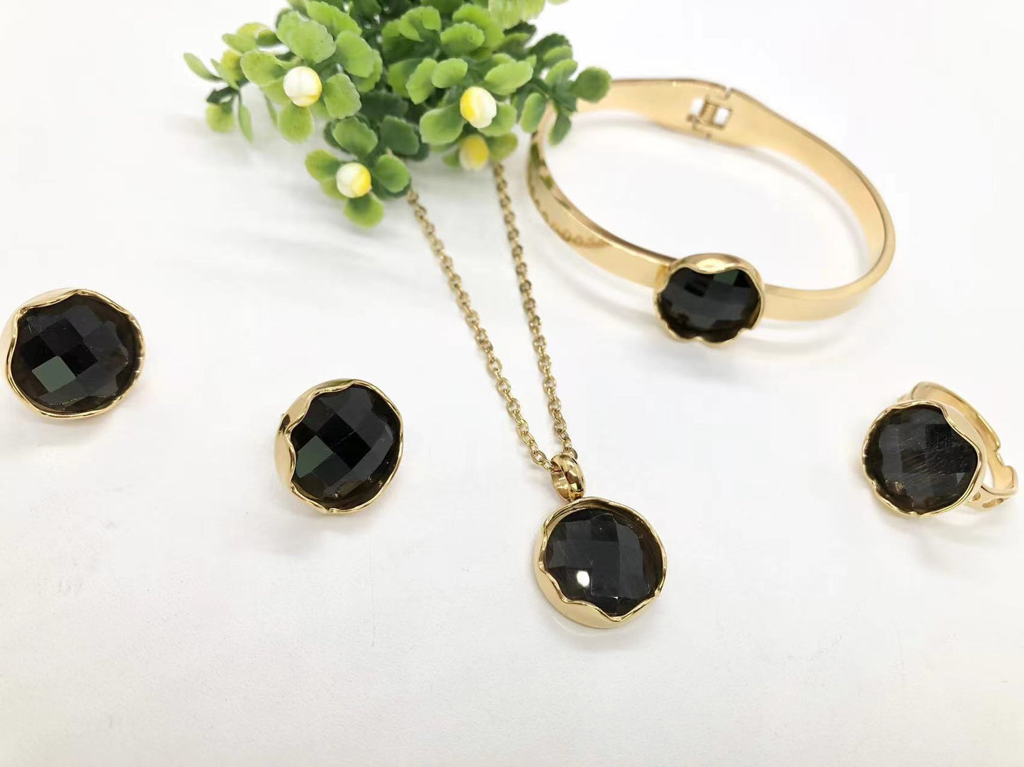 Gorgeous women's stainless steel necklace, earrings, bracelet, and ring set