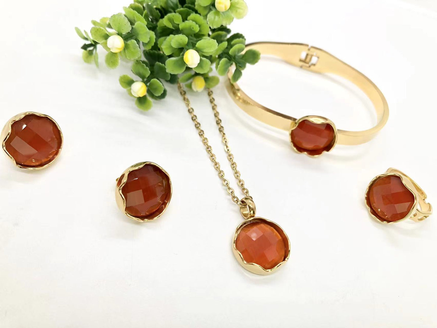 Gorgeous women's stainless steel necklace, earrings, bracelet, and ring set