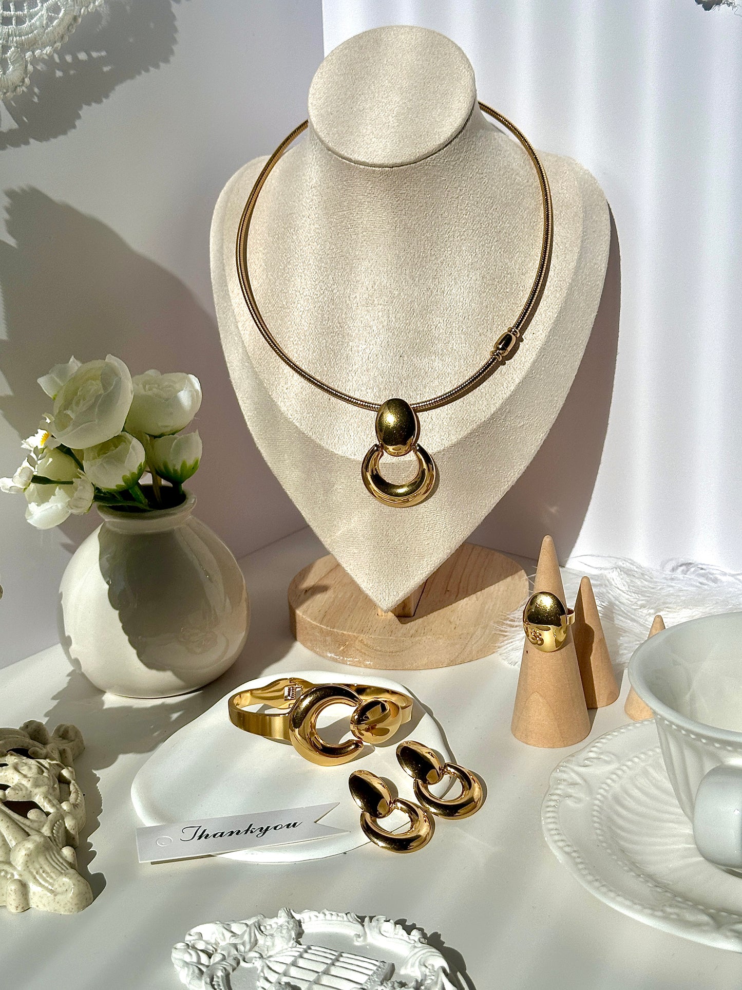 Gorgeous women's stainless steel necklace, earrings, bracelet, and ring set