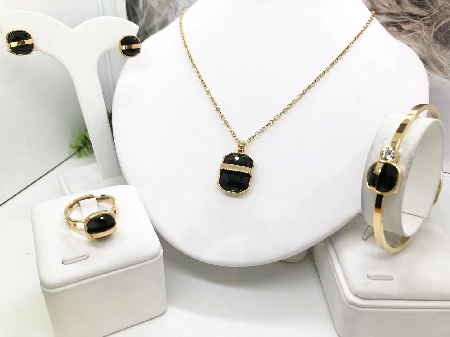 Gorgeous women's stainless steel necklace, earrings, bracelet, and ring set