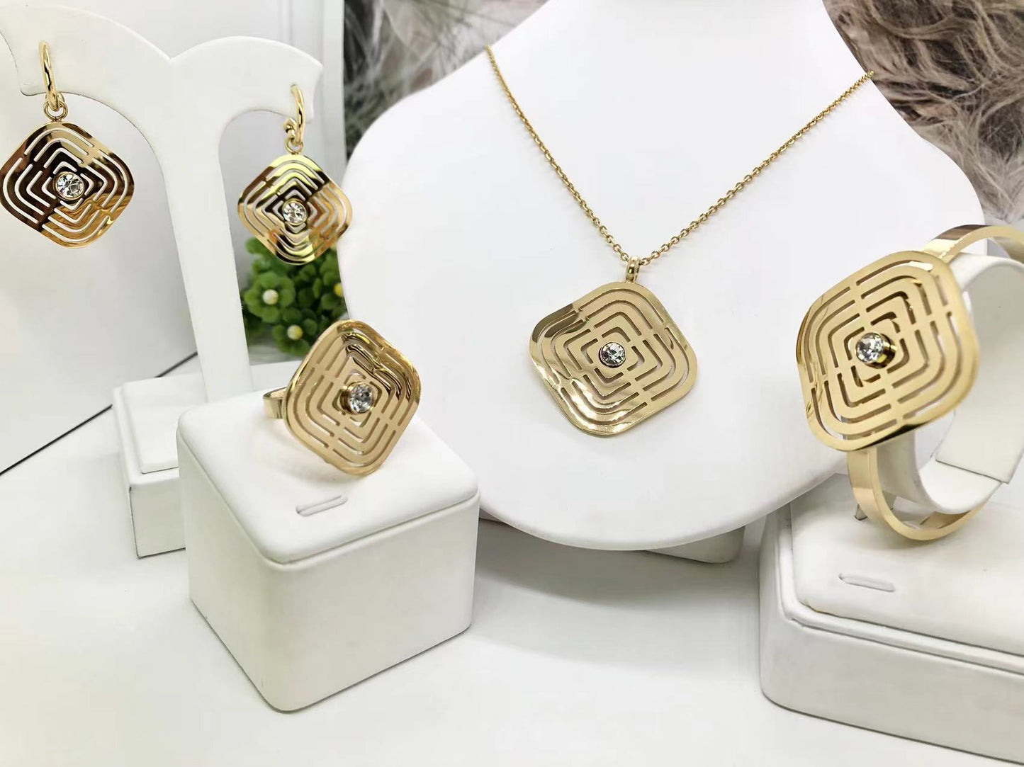 Gorgeous women's stainless steel necklace, earrings, bracelet, and ring set
