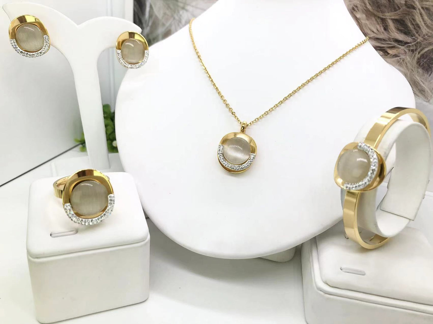 Gorgeous women's stainless steel necklace, earrings, bracelet, and ring set
