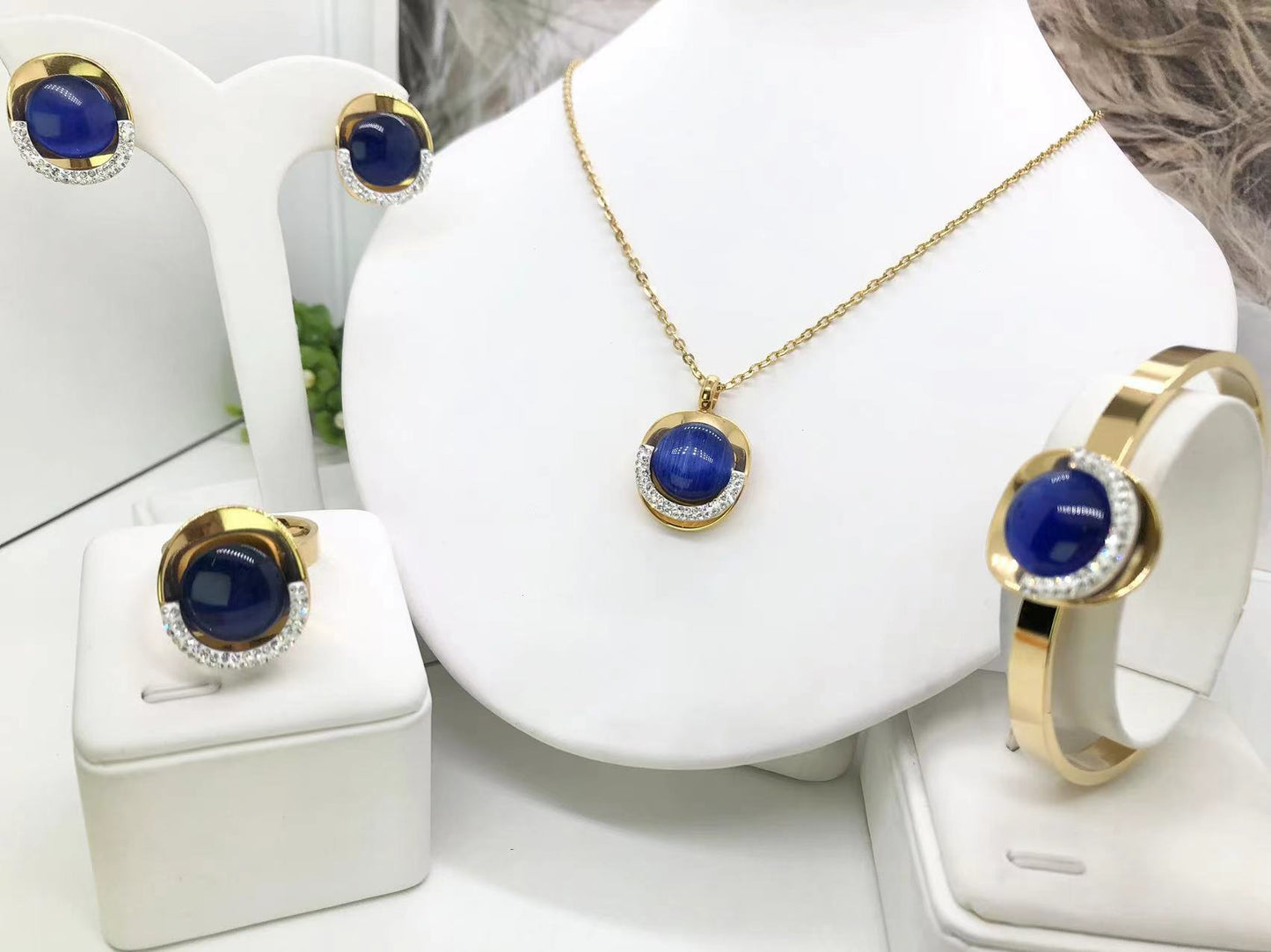 Gorgeous women's stainless steel necklace, earrings, bracelet, and ring set