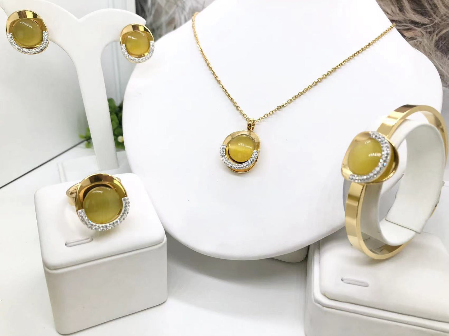 Gorgeous women's stainless steel necklace, earrings, bracelet, and ring set