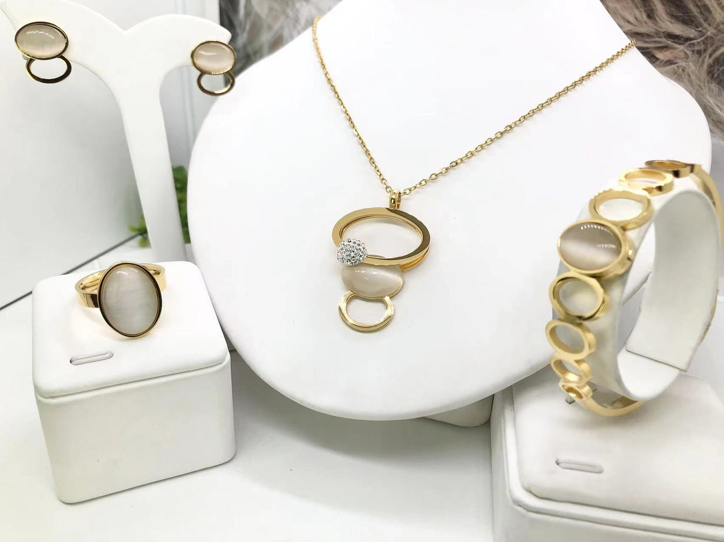 Gorgeous women's stainless steel necklace, earrings, bracelet, and ring set