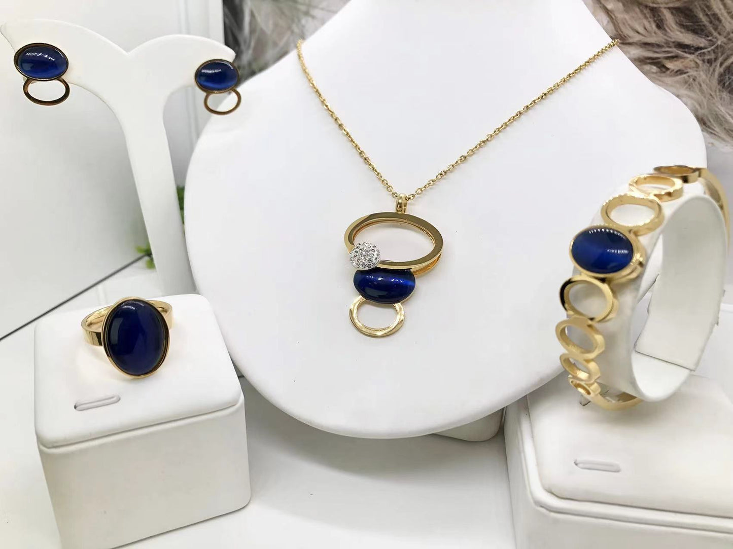 Gorgeous women's stainless steel necklace, earrings, bracelet, and ring set