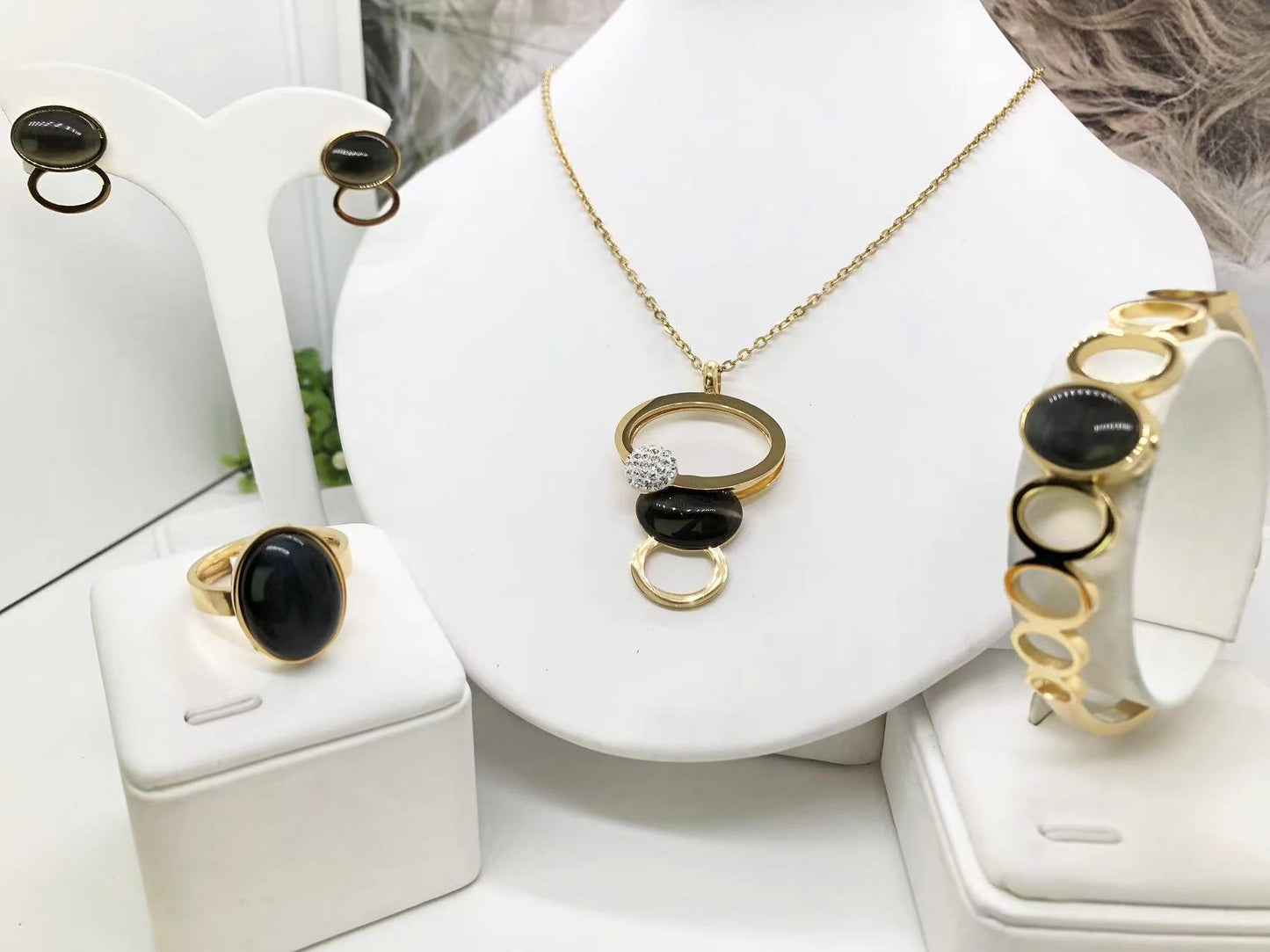 Gorgeous women's stainless steel necklace, earrings, bracelet, and ring set