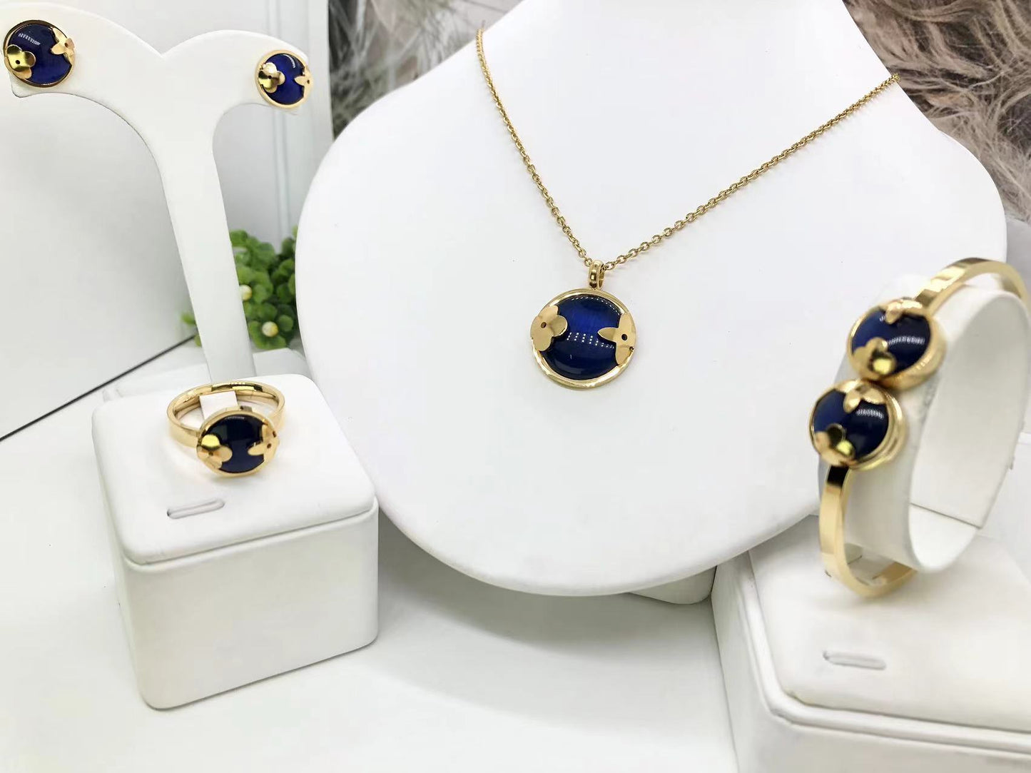 Gorgeous women's stainless steel necklace, earrings, bracelet, and ring set