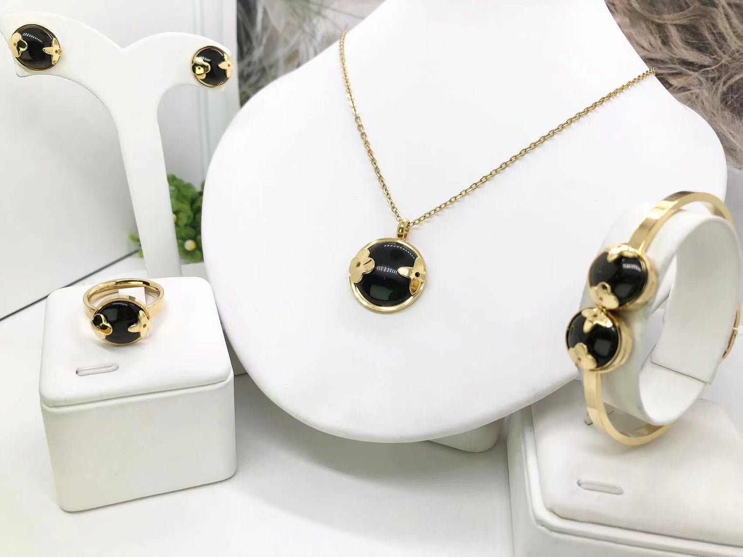 Gorgeous women's stainless steel necklace, earrings, bracelet, and ring set
