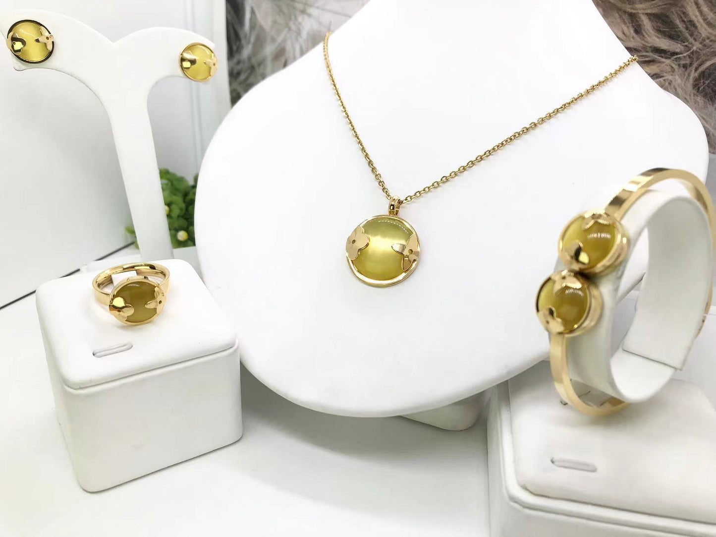 Gorgeous women's stainless steel necklace, earrings, bracelet, and ring set