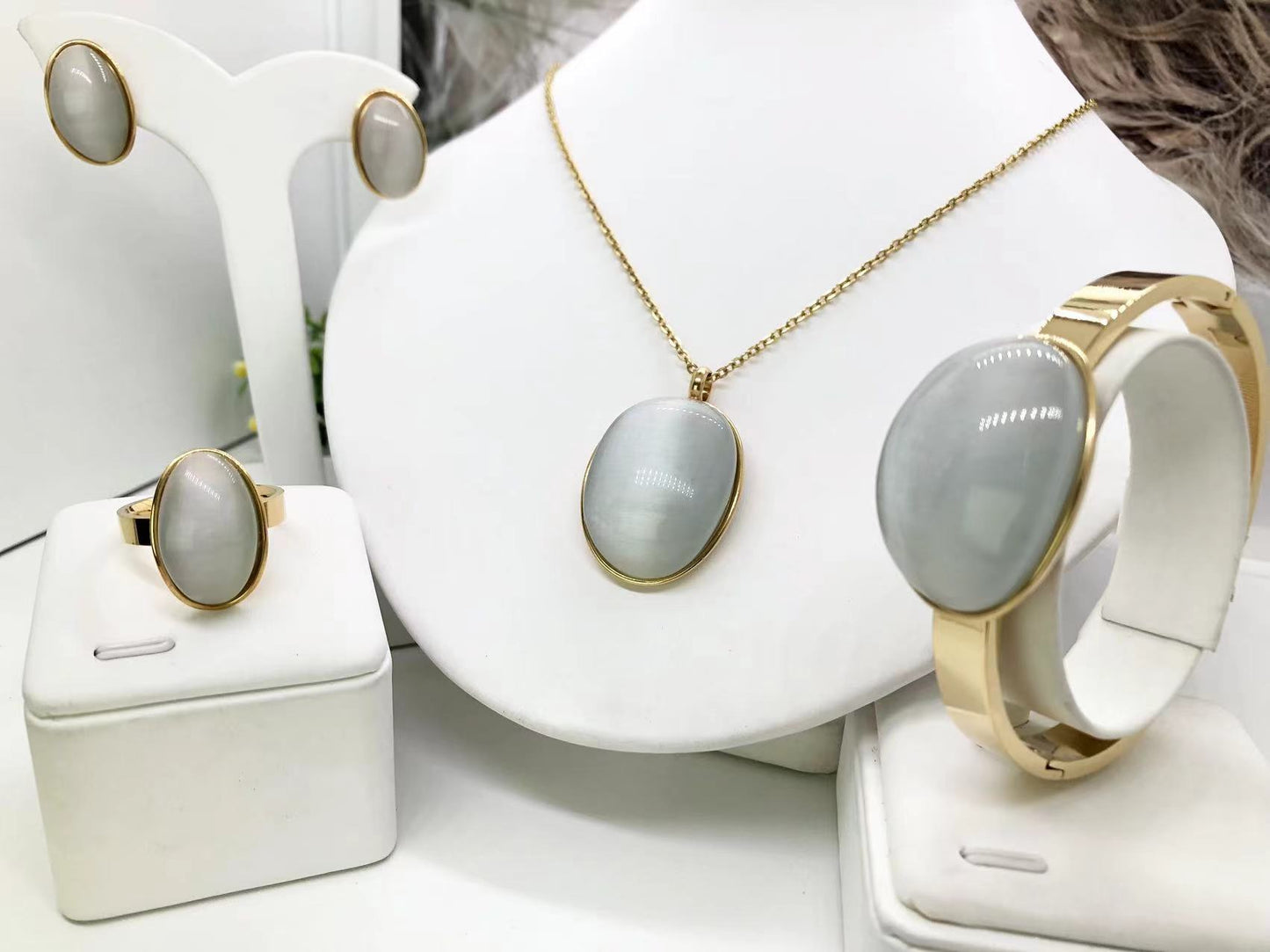 Gorgeous women's stainless steel necklace, earrings, bracelet, and ring set