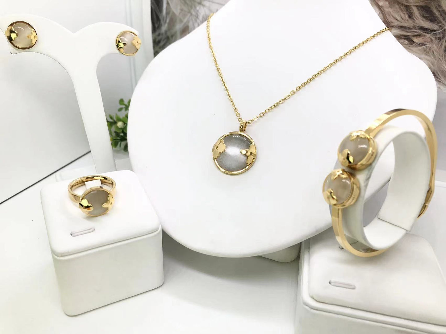 Gorgeous women's stainless steel necklace, earrings, bracelet, and ring set