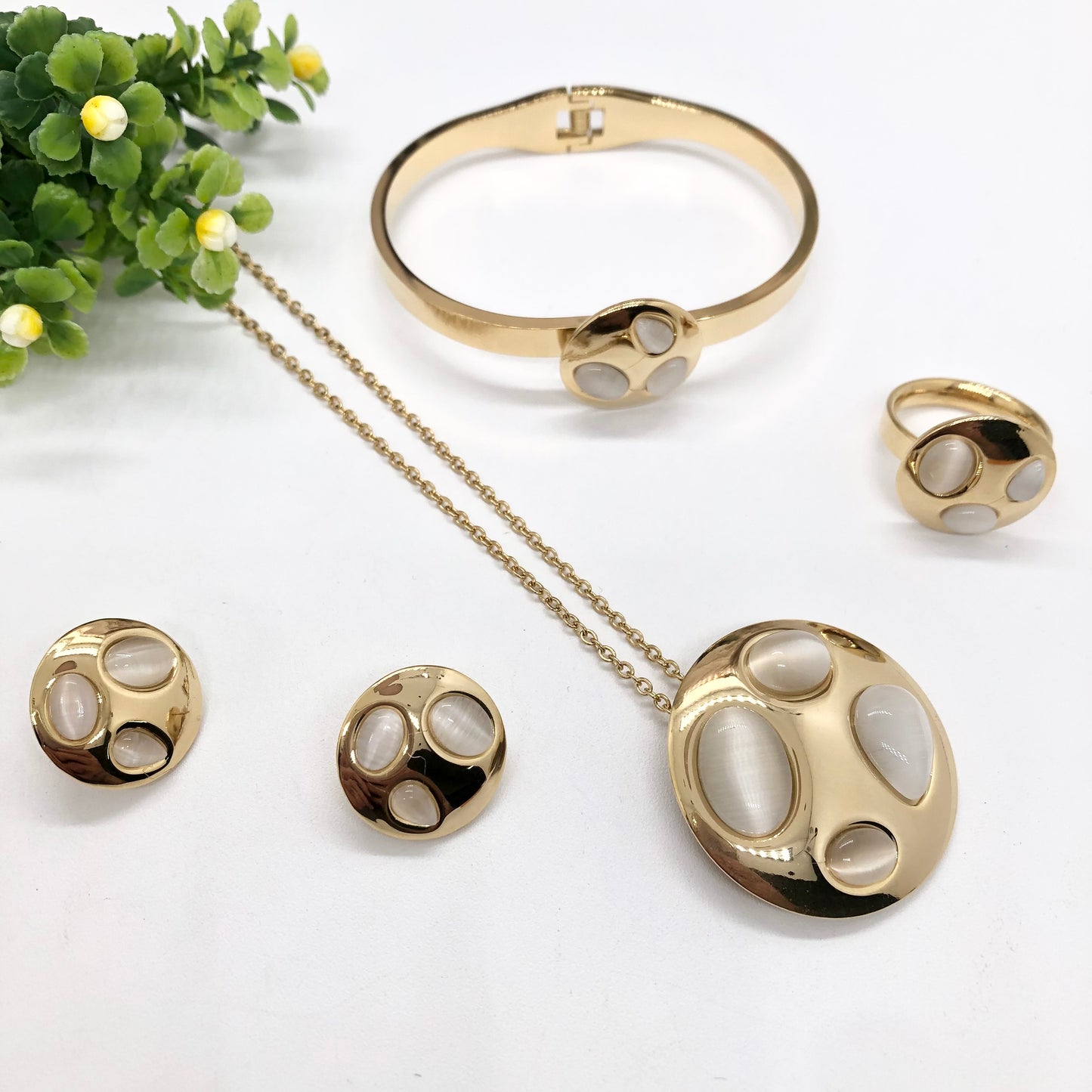 Gorgeous women's stainless steel necklace, earrings, bracelet, and ring set
