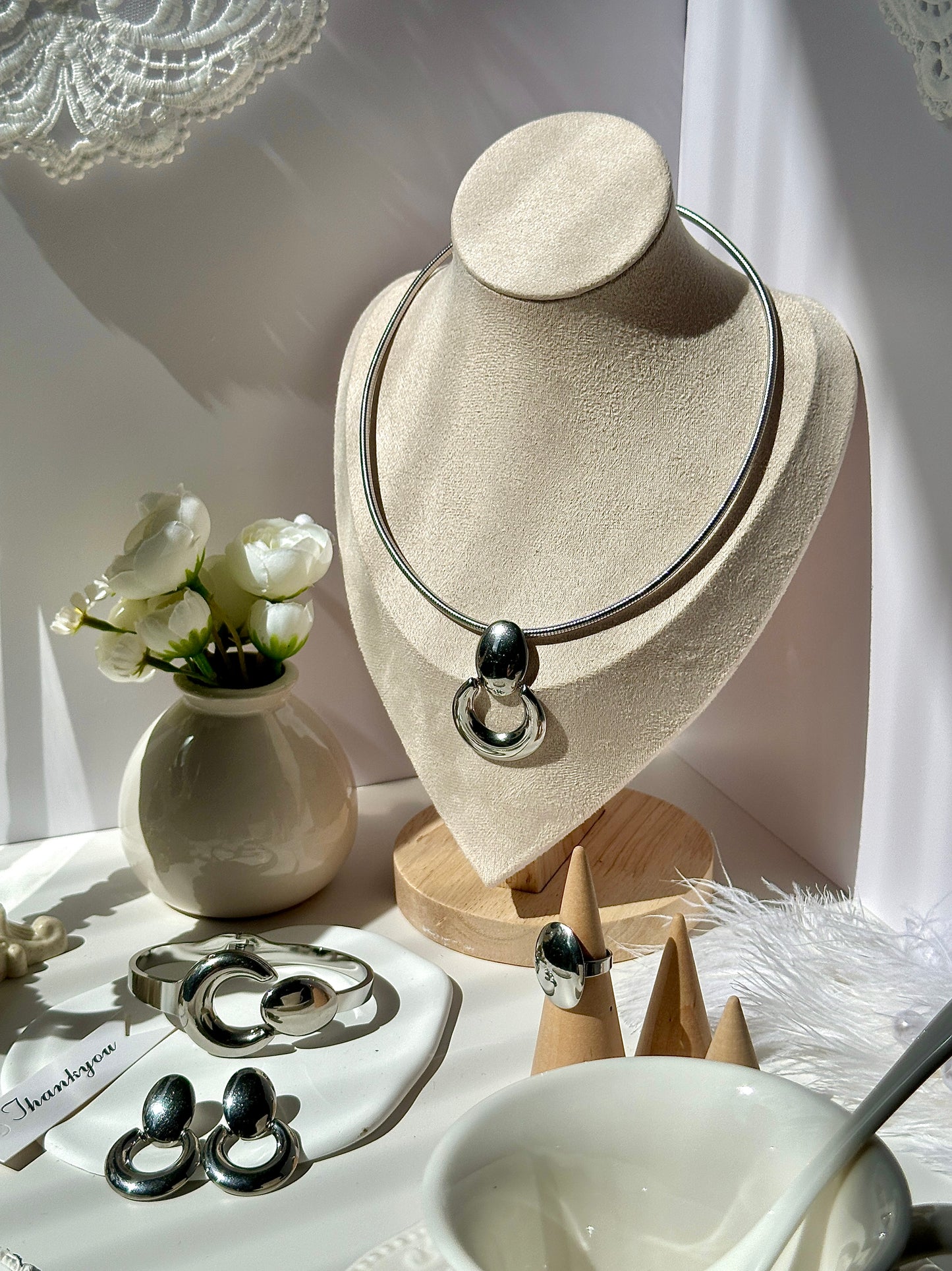 Gorgeous women's stainless steel necklace, earrings, bracelet, and ring set