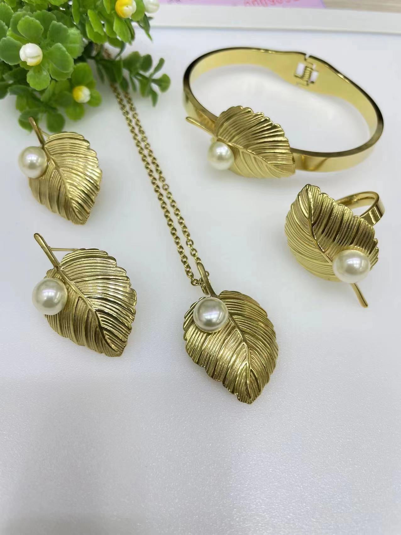 Gorgeous women's stainless steel necklace, earrings, bracelet, and ring set
