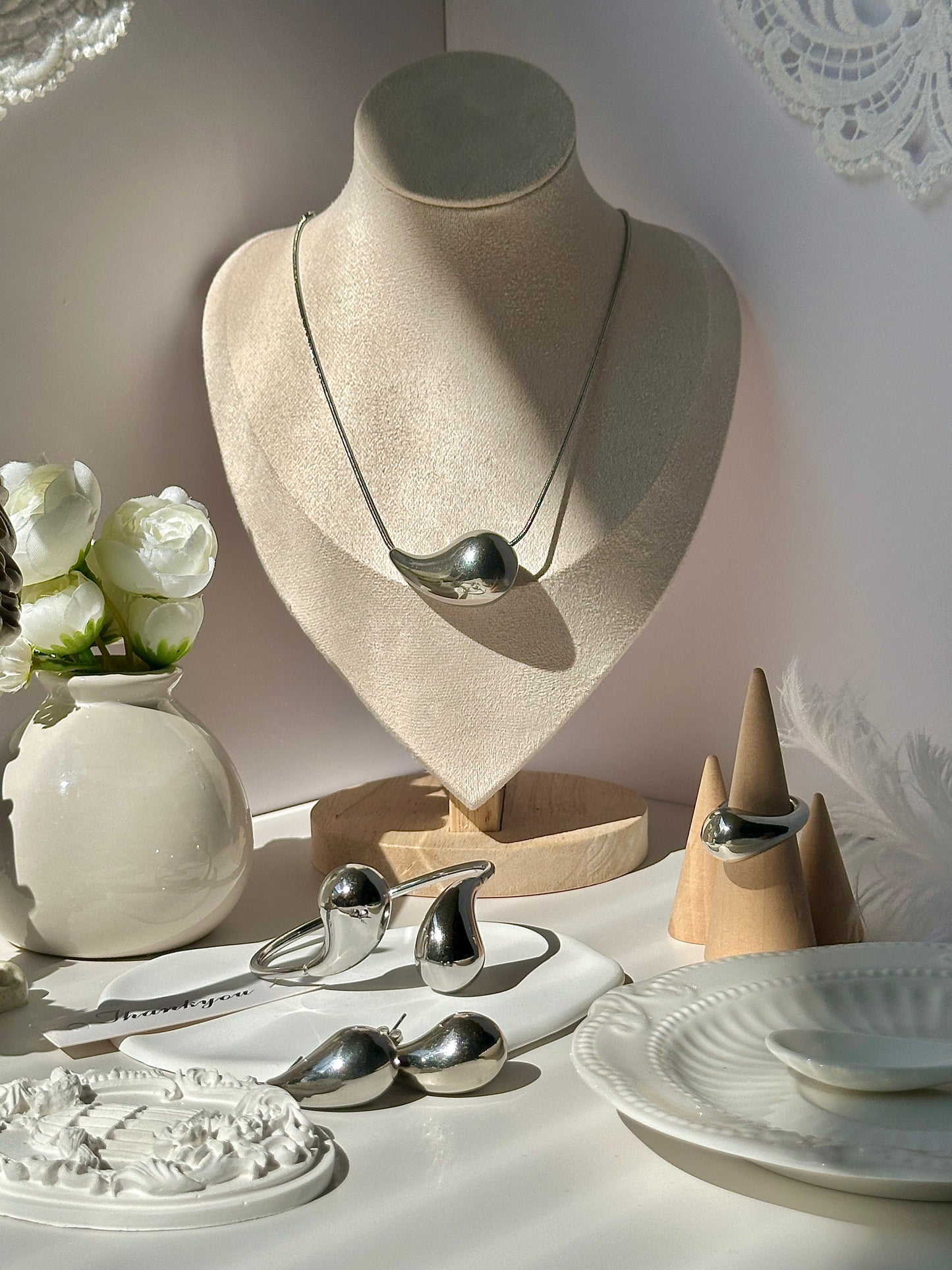 Gorgeous women's stainless steel necklace, earrings, bracelet, and ring set