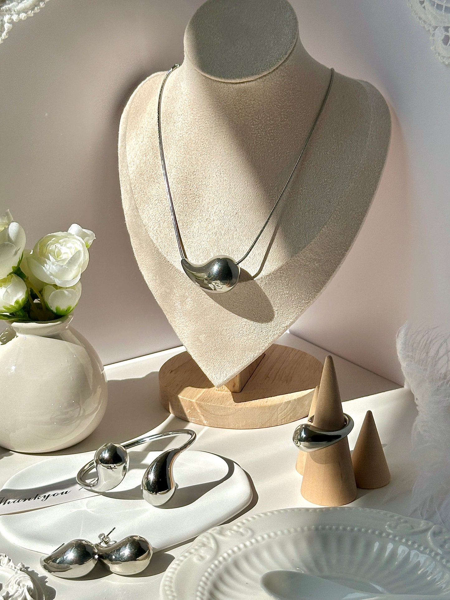 Gorgeous women's stainless steel necklace, earrings, bracelet, and ring set